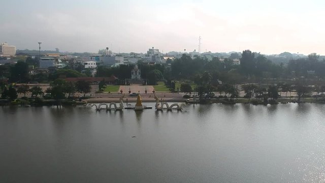 The high angle view of the Prayao Lake from a drone, can see the Naga statue, the local holy thing in this province.