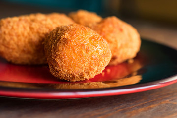 Freshly cooked breaded meat cutlets on plate