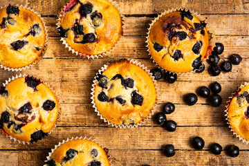 Obraz na płótnie Canvas Muffins with berry fruit on a table