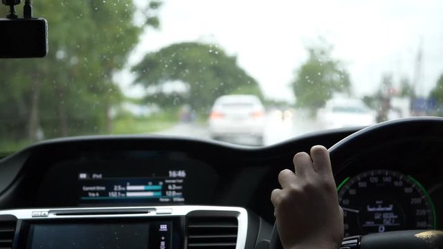 slow motion, car driving on road with rainy day weather