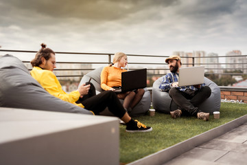 Business people communication, office teamwork. 30 years old people on roof coworking area.
