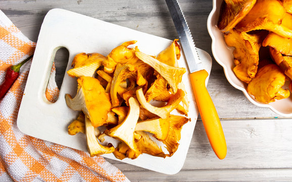 Golden chanterelle mushroom on cutting board