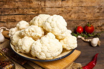 Cauliflower pieces on a rustic table