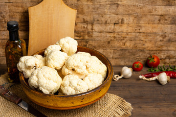 Cauliflower pieces on a rustic table