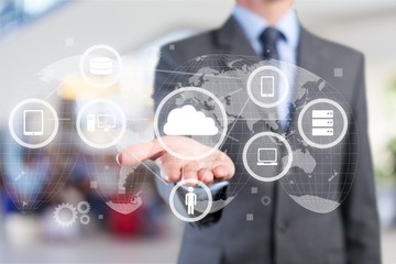 Man touching business element icons on screen