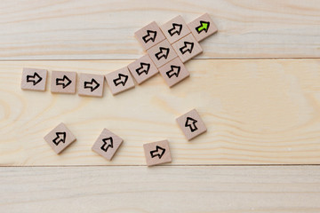 Arrow sign on wood with leadership concept