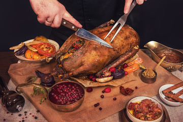 Roasted stuffed goose with herbs berries and vegetables. Ready to Christmas time. © olinchuk