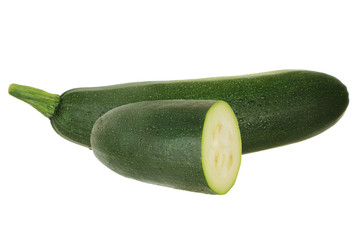 two halves of green zucchini isolated on white