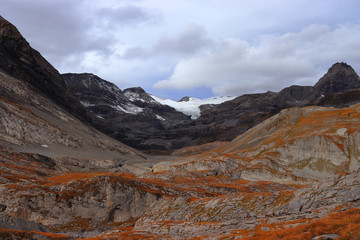 Autumn colors in the high mountains of Switzerland. Gemmi Pass (2,270 m / 7,448 ft) near Leukerbad, canton of Valais, Switzerland.