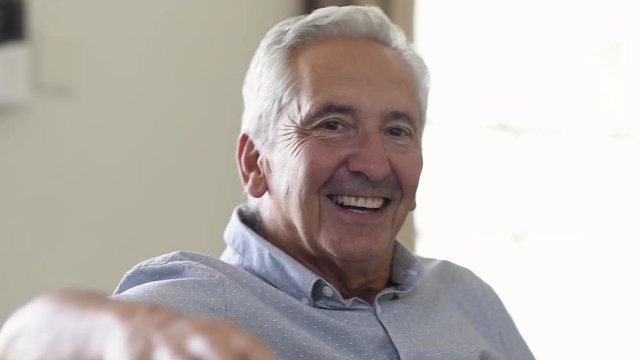 Senior man smiling at home