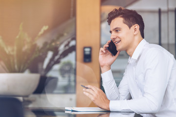 Businessman is talking on phone