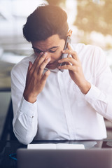 Businessman is talking on phone