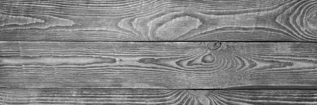 The background of the wooden texture boards black and white. Narrow.