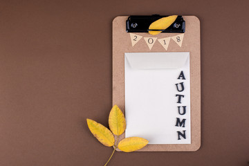 Items for school and office planning day. Autumn decor and yellow leaves. Free space for text. Top view. Copy space.