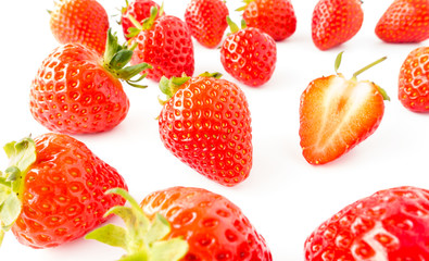 Closeup of Fresh Strawberries with Stems on White Background
