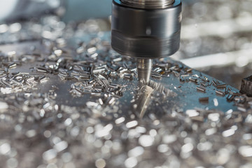 Milling of aluminum plate on a programmable machine. Milling process. © KPad