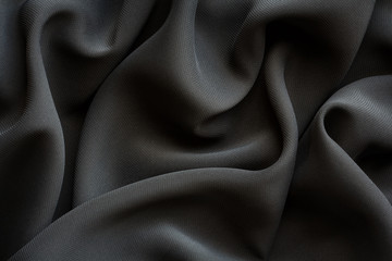 black fabric with large folds,  abstract background
