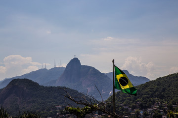 Rio de Janeiro - Flag of Brazil with the Sugar Loaf in the background, in the neighborhood of Urca in the south zone of the city of Rio de Janeiro