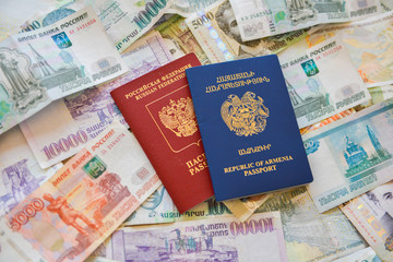 Russian Armenian passport and rubles  on the background.