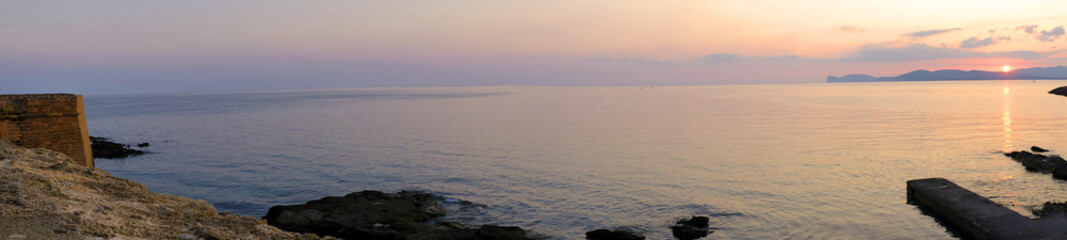 Alghero, Italy - Panoramic sunset view of the Gulf of Alghero