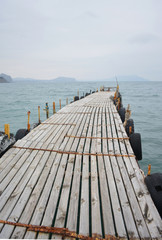 Fototapeta premium Wooden jetty by the sea for small yachts, pier