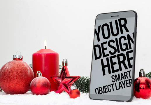 Smartphone near Holiday Decorations Mockup
