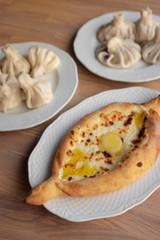 Khachapuri and khinkali on a plate. National Georgian dish