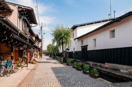 Old houses and Japanese tourist on street of Hida Furukawa old town, Gifu. Japan