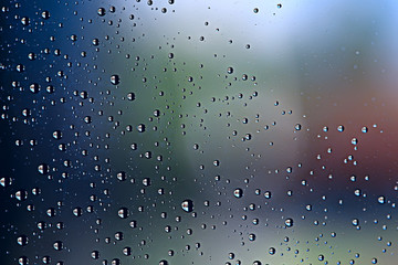 gray wet background / raindrops to overlay on the window, weather, background drops of water rain on the glass transparent