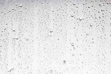 gray wet background / raindrops to overlay on the window, weather, background drops of water rain on the glass transparent - obrazy, fototapety, plakaty