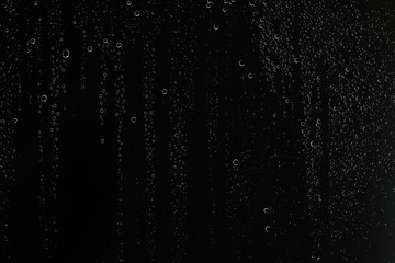 black wet background / raindrops for overlaying on window, concept of autumn weather, background of...