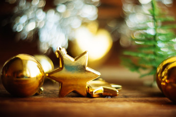 Christmas toys, Christmas decor gold color. Santa's boot, balls, star.
