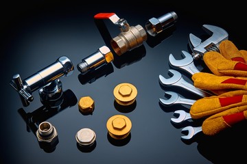 Set plumbing and tools on a green background.