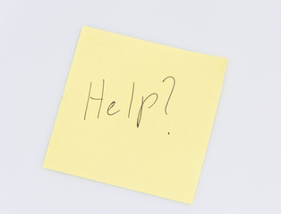 Note with the word Help written on it