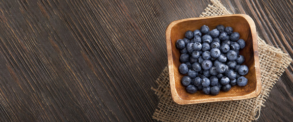 ripe sweet blueberries on wooden table