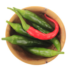 heap of color chili pepper in wooden cup isolated on white