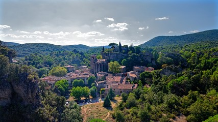 Fototapeta na wymiar Village surrounded by hills and forest in southern France
