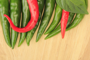 heap of chili pepper on wooden background
