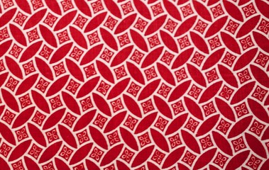 Fragment of colorful retro tapestry text. Fabric striped, flowered texture.