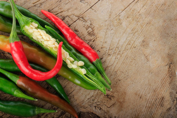 heap of chili pepper on wooden background