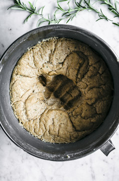 Rosemary, garlic, and olive oil rye dough in bowl