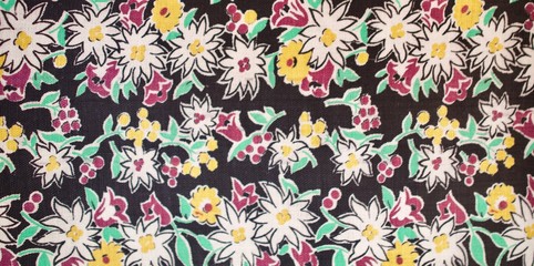 Fragment of colorful retro tapestry text. Fabric striped, flowered texture.