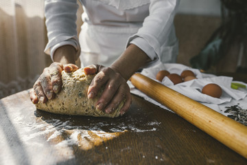 Woman Preparing Homemade Dough in the Kitchen. Preparation Raw Dough for Baking
