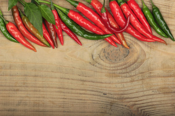 heap of red chili pepper on wooden background