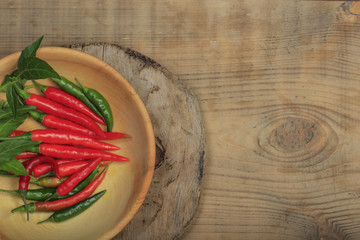 heap of red chili pepper on wooden background