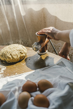 Woman Preparing Homemade Dough in the Kitchen and using a mincing machine. Preparation Raw Dough for Baking