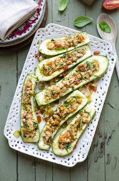 Stuffed zucchini with turkey, cheese and smoked paprika served on plate