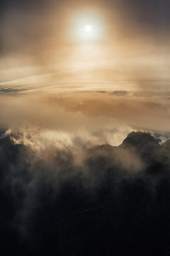 Sun peering through clouds