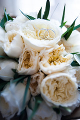 Beautiful wedding bouquet and rings