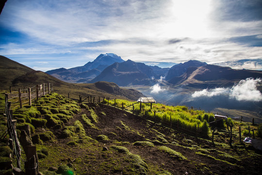 Mountains With Green Flanks And a Glacier In The Background
